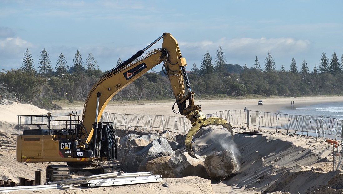 The rock seawall was 'hand placed' by excavators